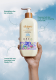 Kids shampoo hand holding product